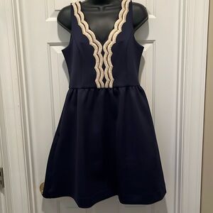 Lilly Pulitzer Navy dress with gold trim neckline in front & back. Size Medium.